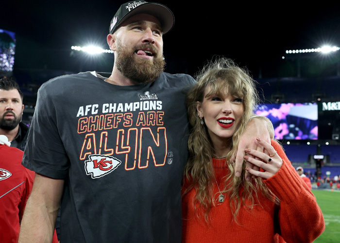 Taylor Swift and partner celebrating at AFC Champions game with Kansas City Chiefs apparel