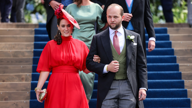 Sofia Maduro Vollmer and Prince Joseph Wenzel, Prince of Liechtenstein, walking down steps in formal attire