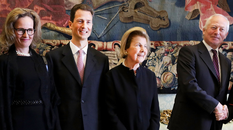 Princess Sophie, Prince Alois, Princess Marie, and Prince Hans-Adam II smiling fora photo