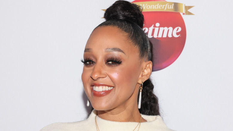 Tia Mowry in 2025 smiling during a red carpet event