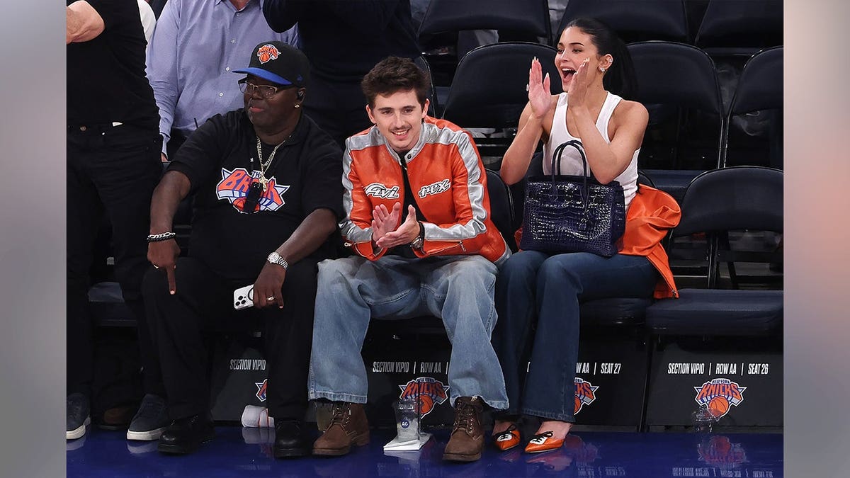 Actor Timothée Chalamet and media personality Kylie Jenner reacting during NBA playoff game at Madison Square Garden