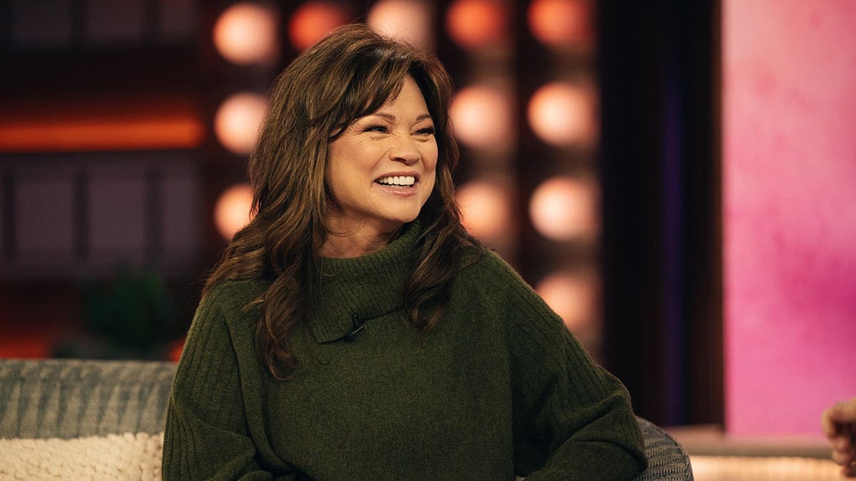Valerie Bertinelli wearing a green sweater on The Kelly Clarkson Show set