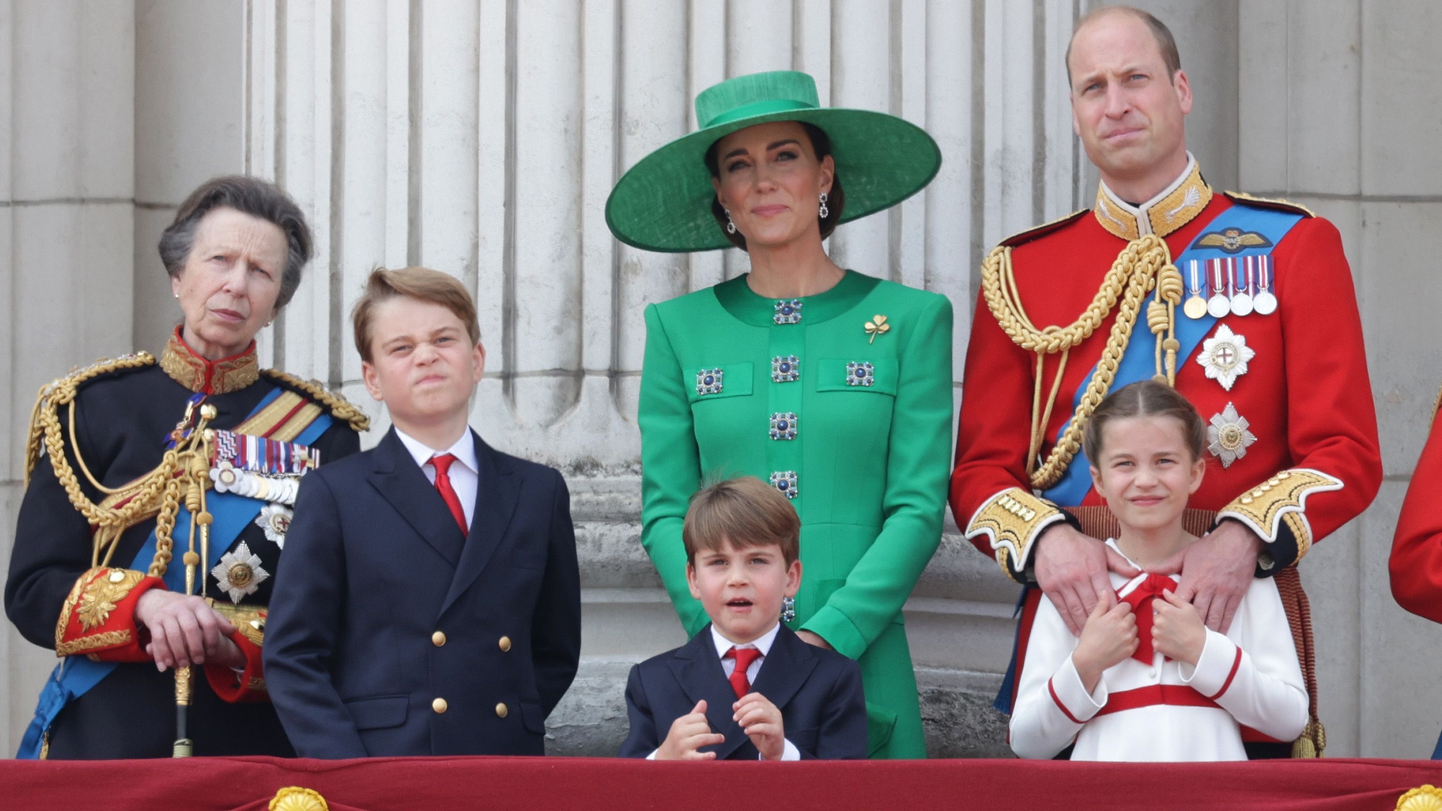 Princess Anne, Prince George, Prince Louis, Catherine, Princess of Wales, Princess Charlotte and Prince William stand on the balcony of Buckingham Palace at Trooping the Colour