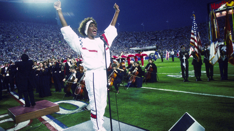Whitney Houston singing at a football game