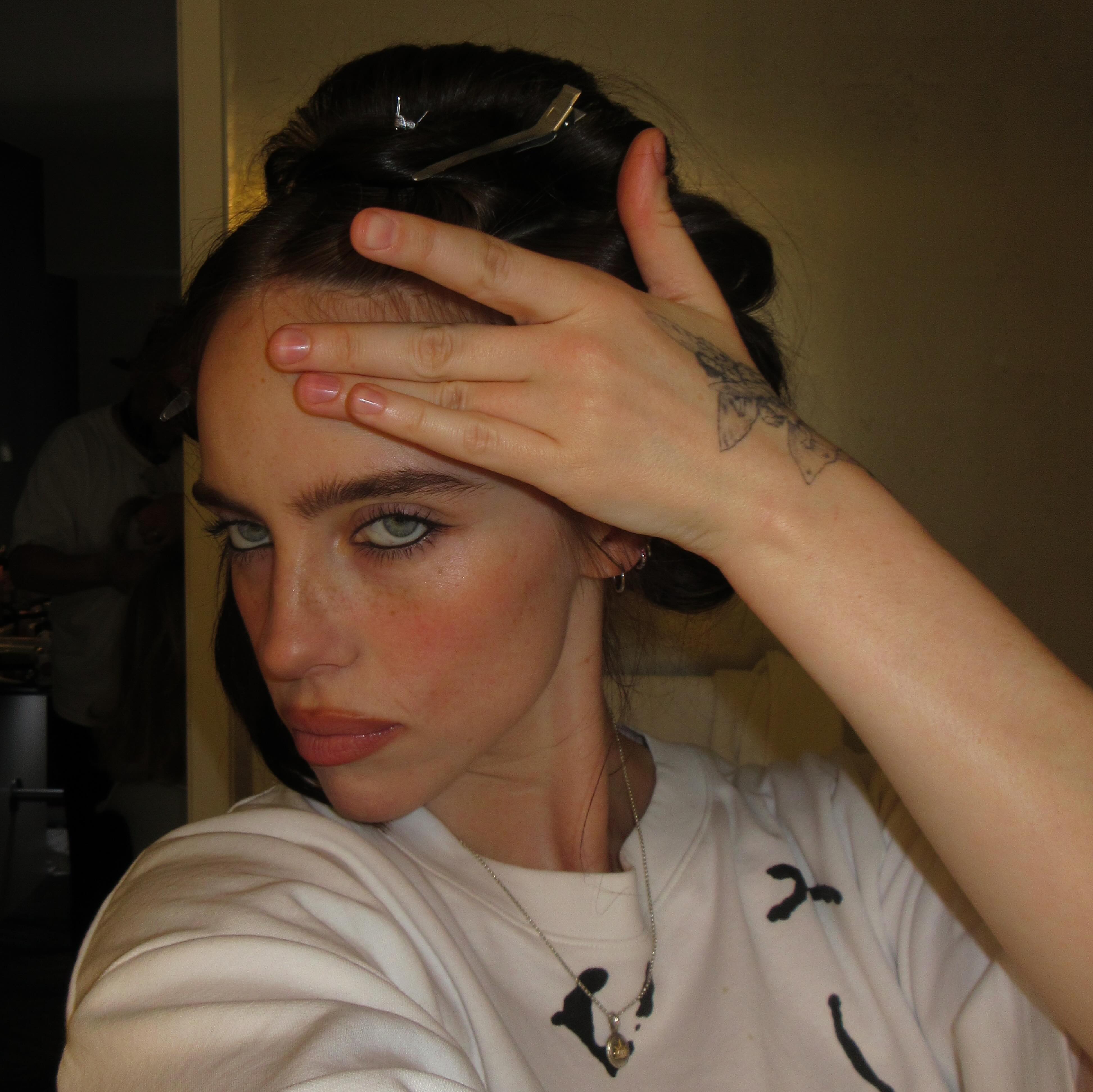 Billie Eilish shows off some natural glam.
