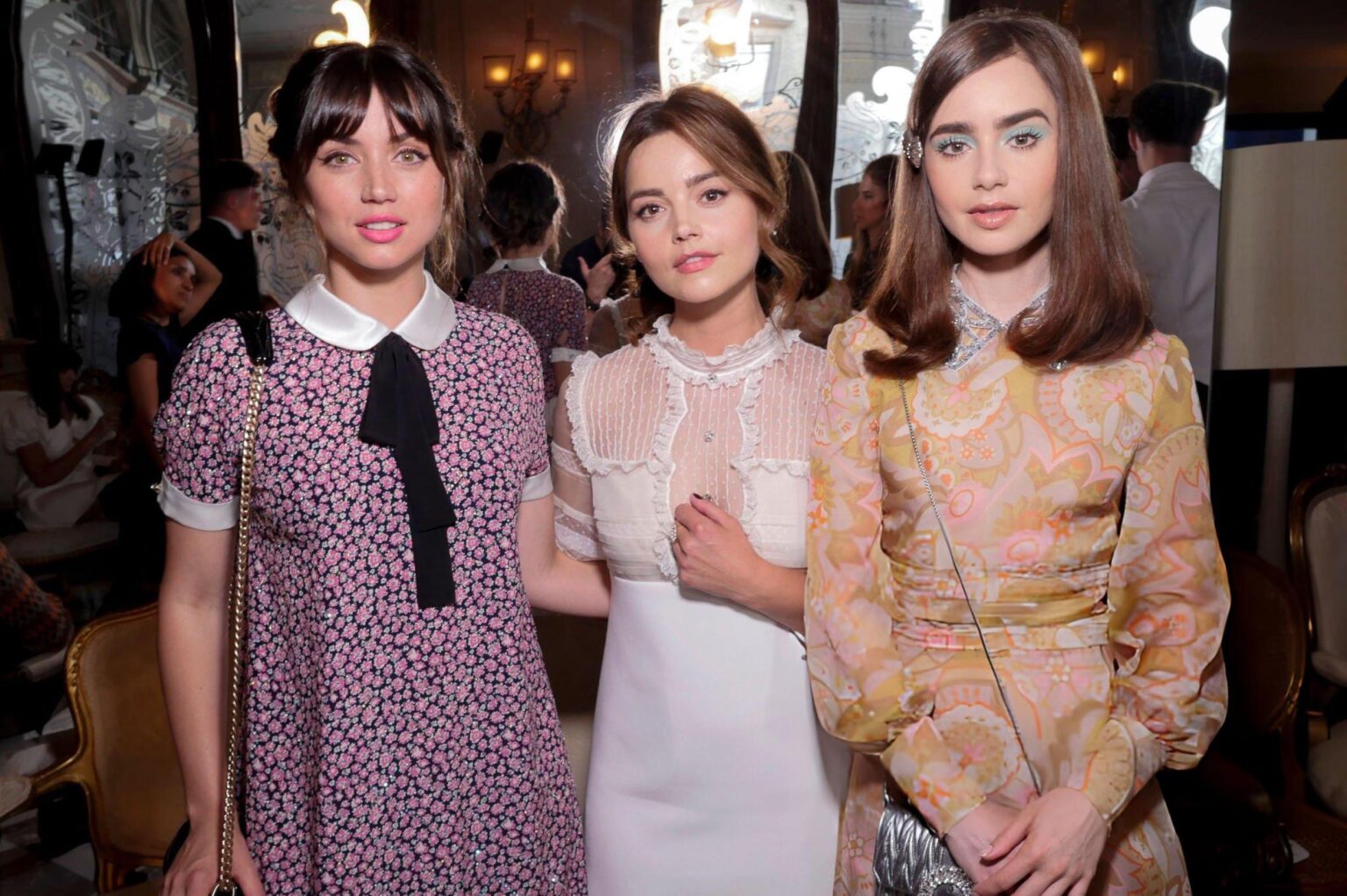 Lily Collins with Ana de Armas and Jenna Coleman at the Miu Miu Cruise Collection show in Paris — June 30, 2018.