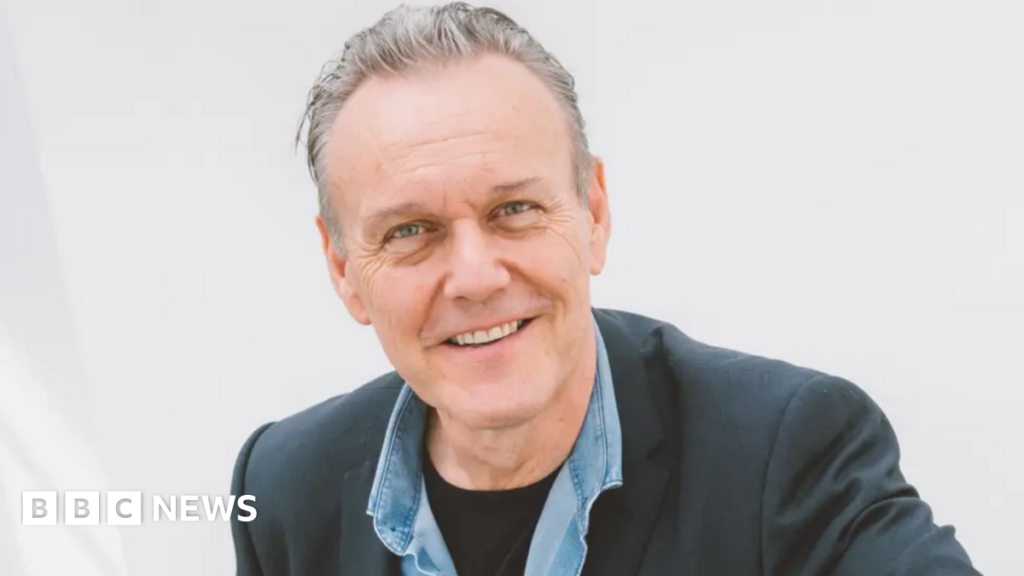 Anthony Head in glasses in a still from Buffy in 1998