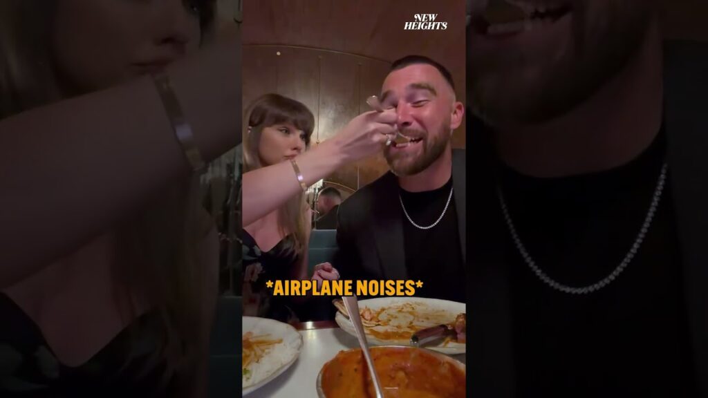 Taylor Swift Pokes Fun At ‘New Heights’ Joke While Feeding Travis Kelce With Airplane Noises Taylor Swift Pokes Fun At 'New Heights' Joke While Feeding Travis Kelce With Airplane Noises