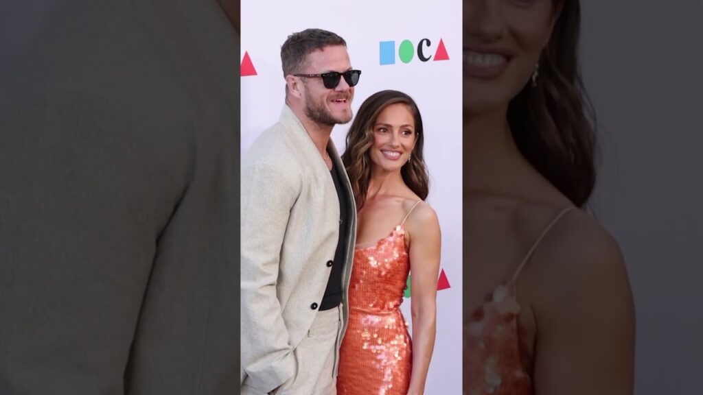 Minka Kelly and Dan Reynolds are on top of the world.🫶