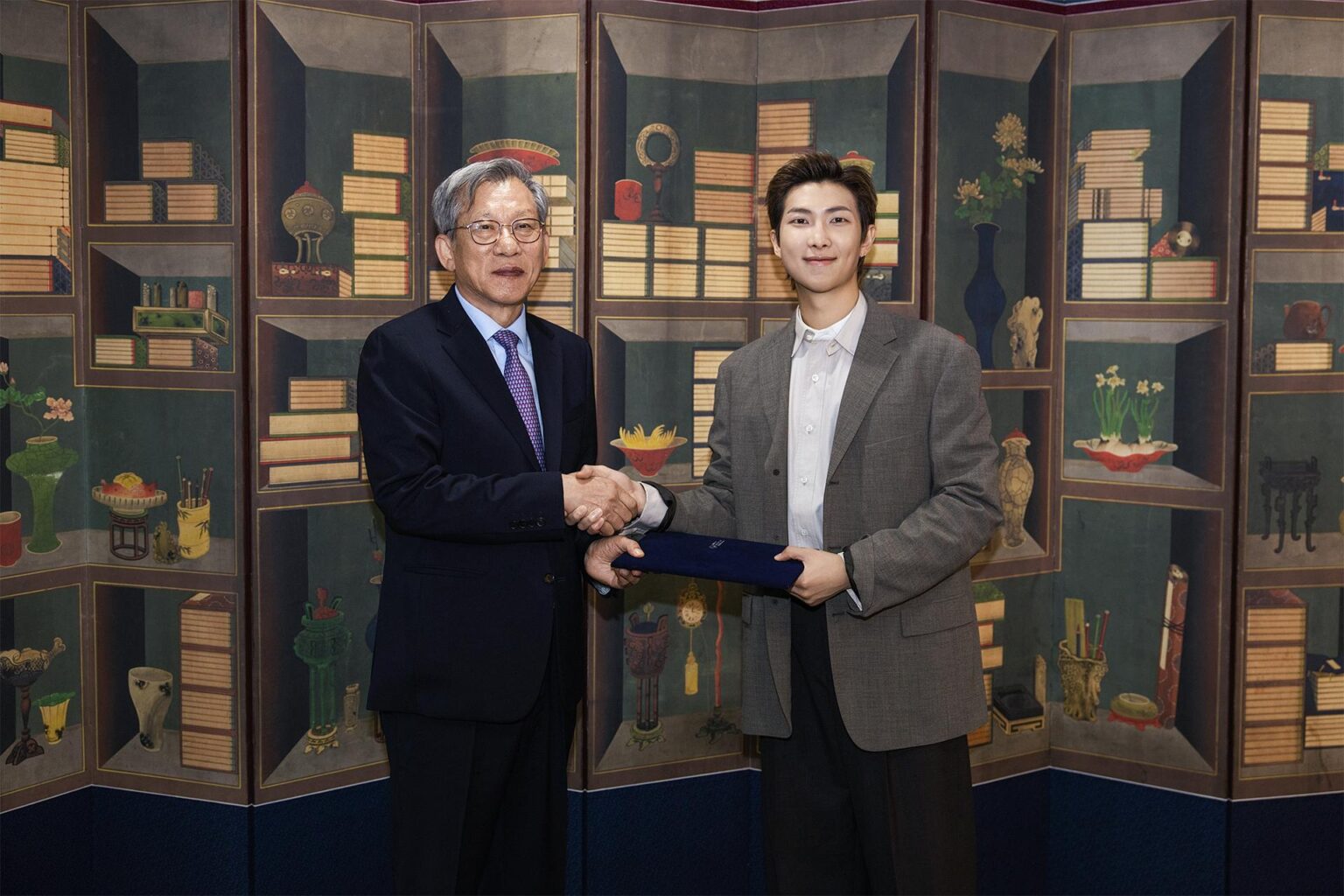 BTS’ RM named first global ambassador of Nat’l Museum of Korea RM, right, the leader of K-pop supergroup BTS, shakes hands with You Hong-june, director of the National Museum of Korea, after being named global ambassador of the museum, in this photo provided by You