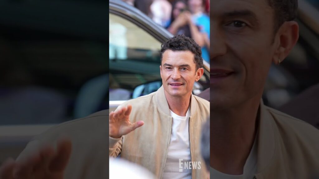 Ciao Orlando Bloom! He greets fans as he arrives at the Tod's presentation during Milan Fashion Week