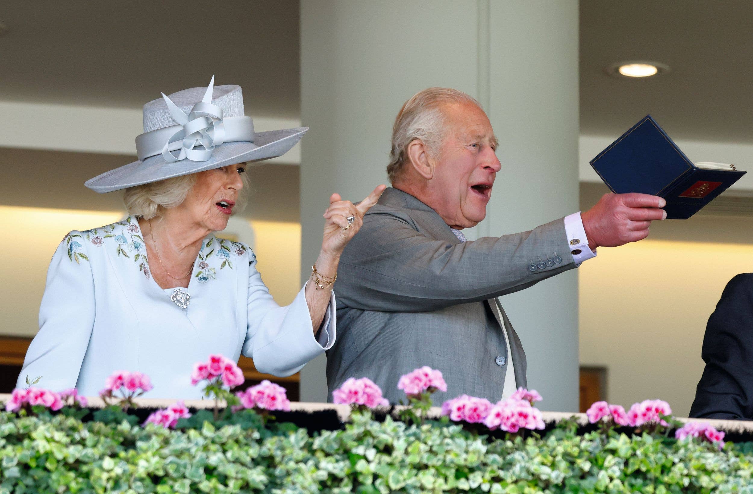 Queen Camilla and King Charles III watch the racing from the Royal Box