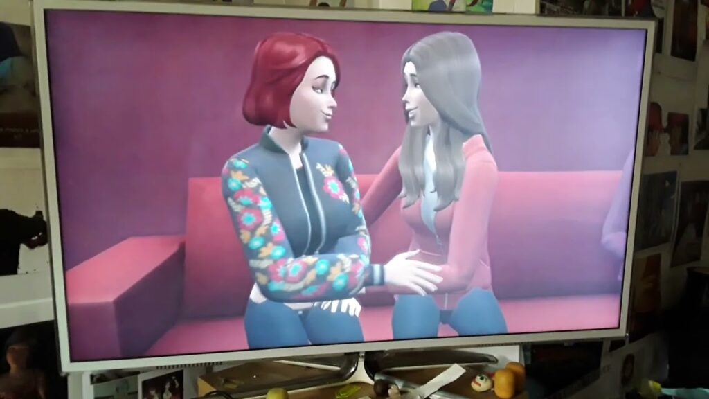 Scarlett Johansson and Elizabeth Olsen kiss on the sofa
