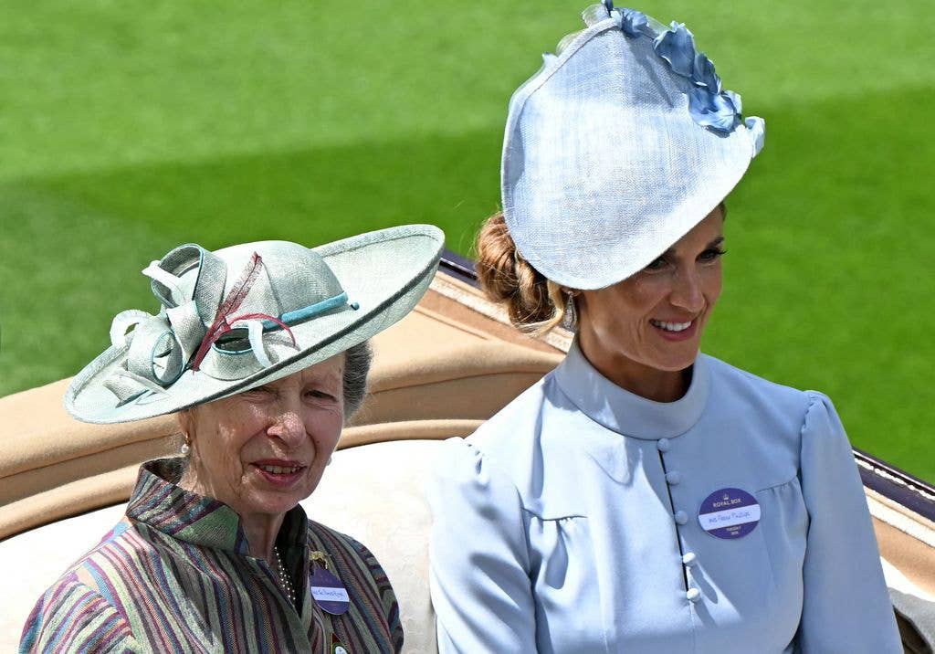 Britain's Princess Anne, Princess Royal (L) and Harriet Sperling arrive by horse-drawn carriage on the first day of the Royal Ascot 