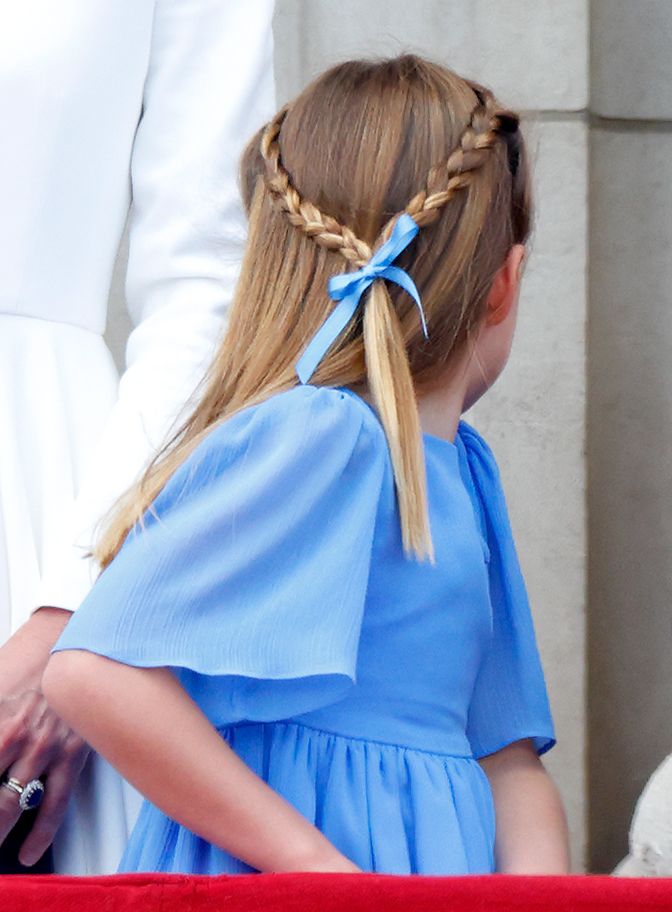 Princess Charlotte's hairstyle at Trooping the Colour 2022 featured two delicate side braids tied with a blue ribbon, a look reminiscent of the romantic beauty associated with Empress Sissi.