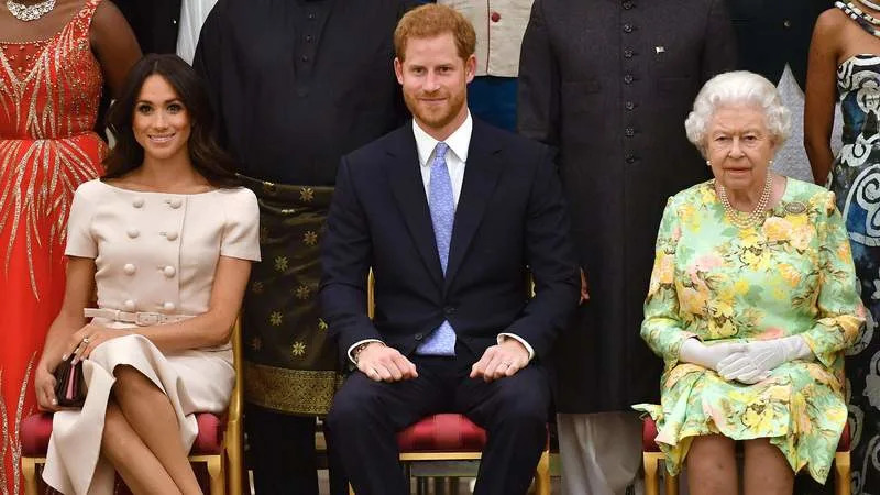 Meghan Markle, Prince Harry and Queen Elizabeth II attend the Young Leaders Awards Ceremony in 2018. By: MEGA