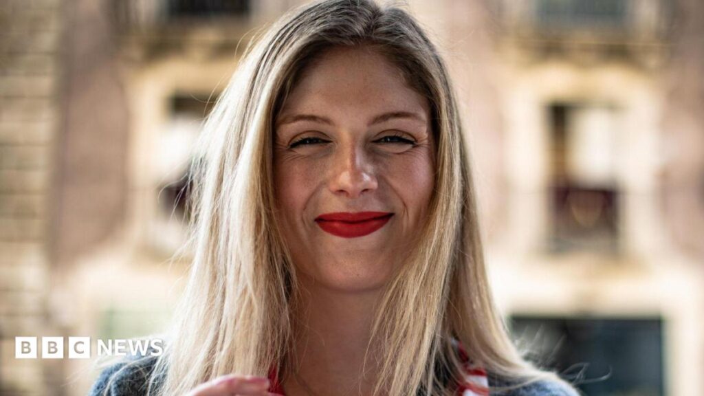 Woman told family to start charity helping carers of terminally ill people A young woman with long blonde hair and red lipstick smiles at the camera.