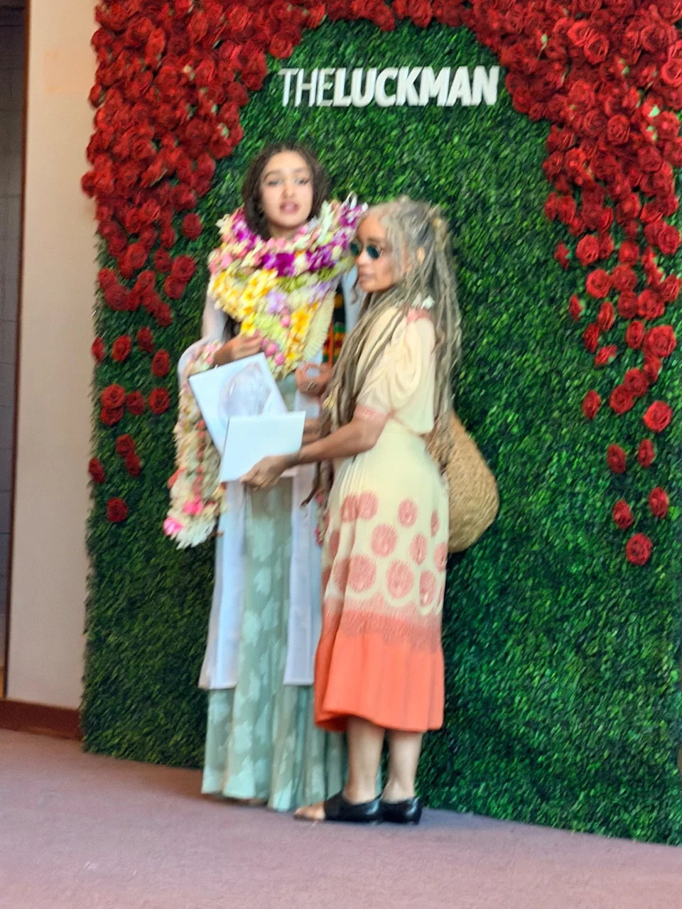 The actress opted for a white and orange sundress, while her daughter wore a pastel green, floor-length sundress. Dsanchez/CPR / BACKGRID