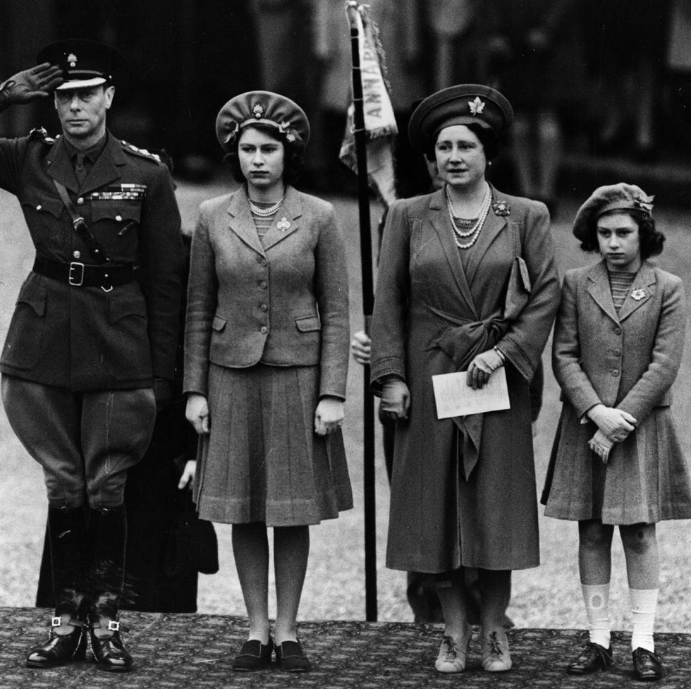 april 1942: king george vi, (1895 1952) queen elizabeth, princess elizabeth (queen elizabeth ii) and princess margaret (1930 2002) inspecting the grenadier guards (who are not visible) on princess elizabeths 16th birthday. (photo by fox photos/getty images)