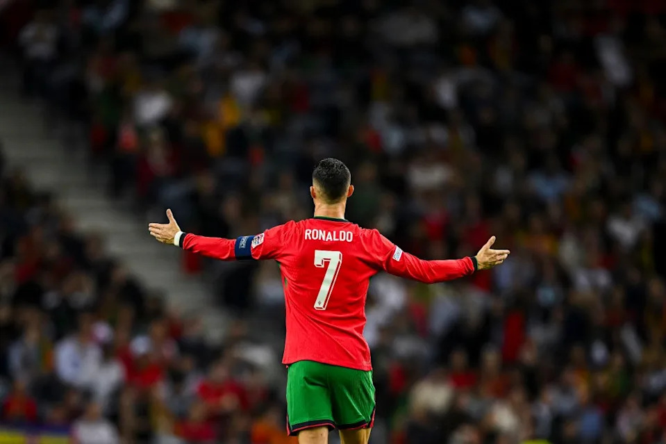 PORTO, PORTUGAL – NOVEMBER 15: Cristiano Ronaldo of <a class="link " href="https://sports.yahoo.com/soccer/teams/portugal/" data-i13n="sec:content-canvas;subsec:anchor_text;elm:context_link" data-ylk="slk:Portugal;sec:content-canvas;subsec:anchor_text;elm:context_link;itc:0" data-yga="{"yLinkElement":"context_link","yModuleName":"content-canvas","yLinkText":"Portugal","ySubModuleName":"anchor_text","yHasCommerce":false}">Portugal</a> reacts during the UEFA Nations League 2024/25 League A Group A1 match between Portugal and Poland at Estadio do Dragao on November 15, 2024 in Porto, Portugal. (Photo by Octavio Passos/Getty Images)