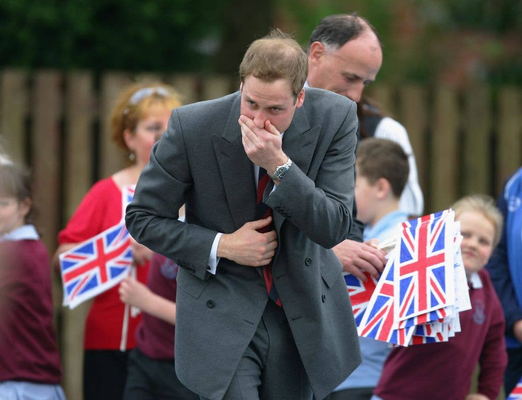 Prince William stifles a sneeze during a visit to St Aidan's Primary School on May 9, 2008 in Blackburn, England