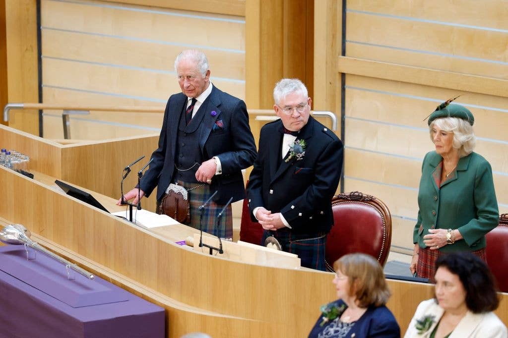 Britain's King Charles III stands with Presiding Officer Kenneth Gibson MSP (C) and Queen Camilla in the Debating Chamber during the opening of the 7th Session of the Scottish Parliament at the Scottish Parliament Building