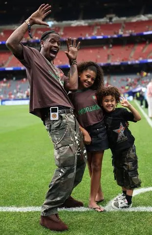 Travis Scott with Stormi and AireCredit: Li Ming/Xinhua via Getty