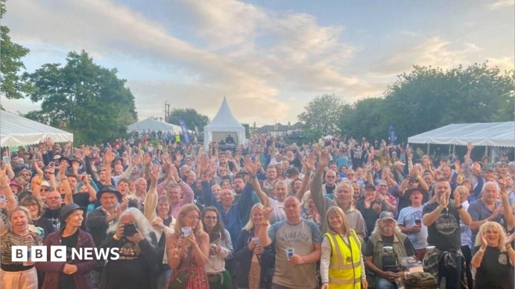 Linton Festival to ‘go out with a bang’ after 25 years A young girl with brown hair sat in a chair. She's facing a reporter who is holding a mic to her face.