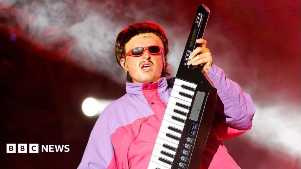 US singer-songwriter Oliver Tree dies in helicopter collision in Brazil Oliver Tree performing wearing shades and playing a keytar during the Exit Festival in Serbia in 2024