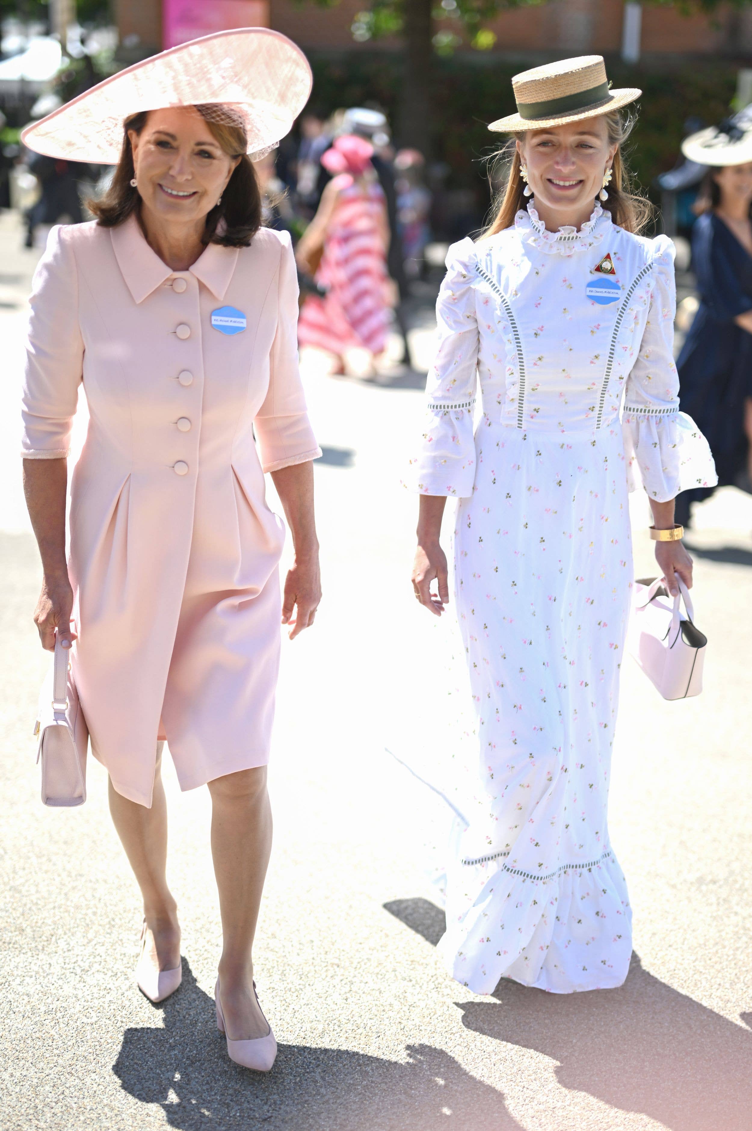 Carole Middleton and her daughter-in-law Alizee Thevenet wear badges describing them as Mrs Michael Middleton and Mrs James Middleton at Royal Ascot