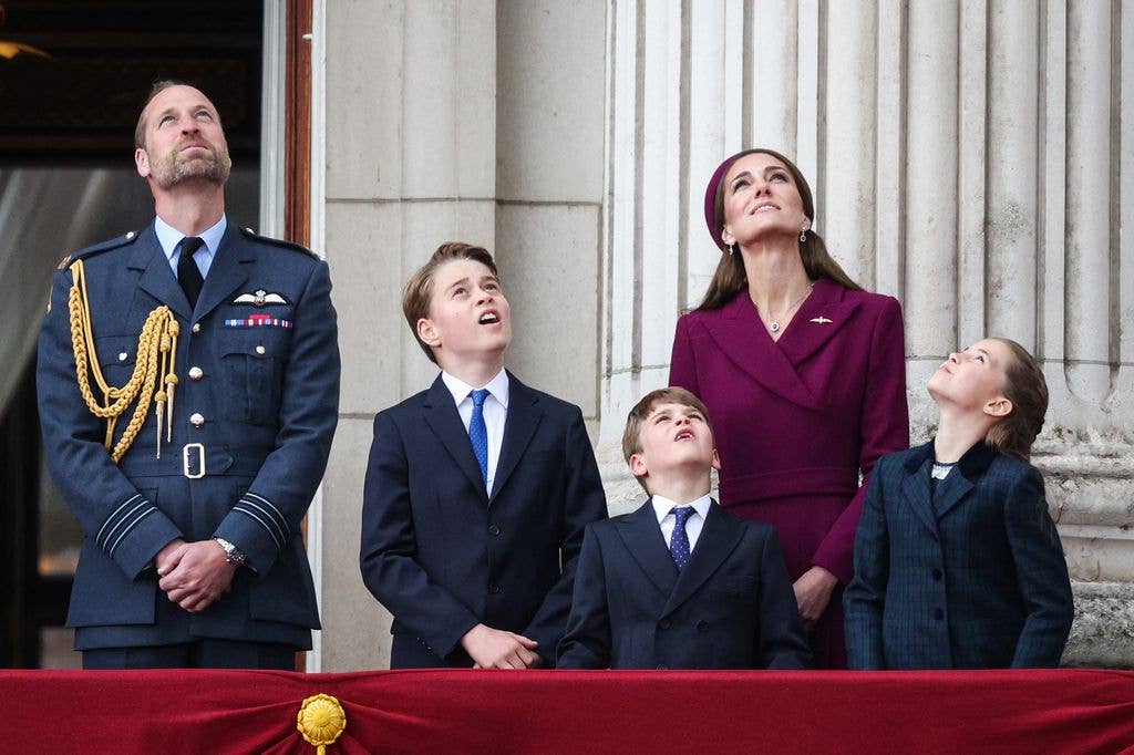 William, Kate, George, Charlotte and Louis look up at flypast