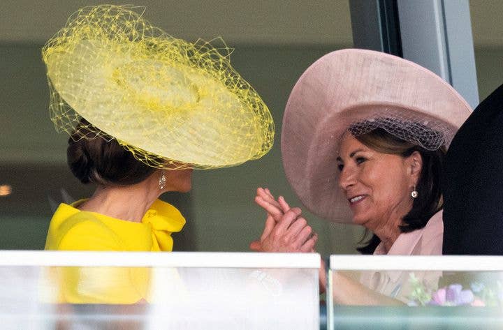 Kate grasps her mother's hand 