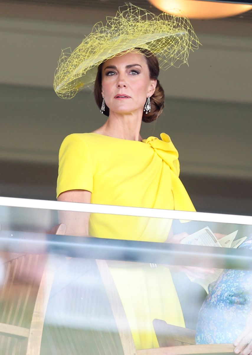 Kate accessorized her monochromatic ensemble with Queen Elizabeth's diamond drop earrings and Princess Diana's iconic pearl bracelet.
