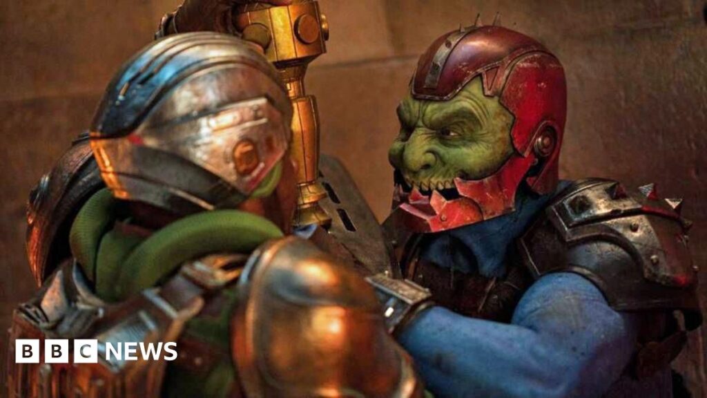 Masters of the Universe actor ‘starstruck’ working with Idris Elba Samuel C Wilson as evil cyborg, Trap Jaw. He is wearing green makeup, prosthetics and armour