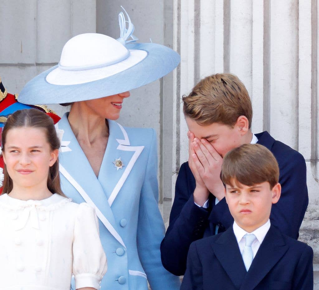 George sneezes as his mother looks on at this year's Trooping event