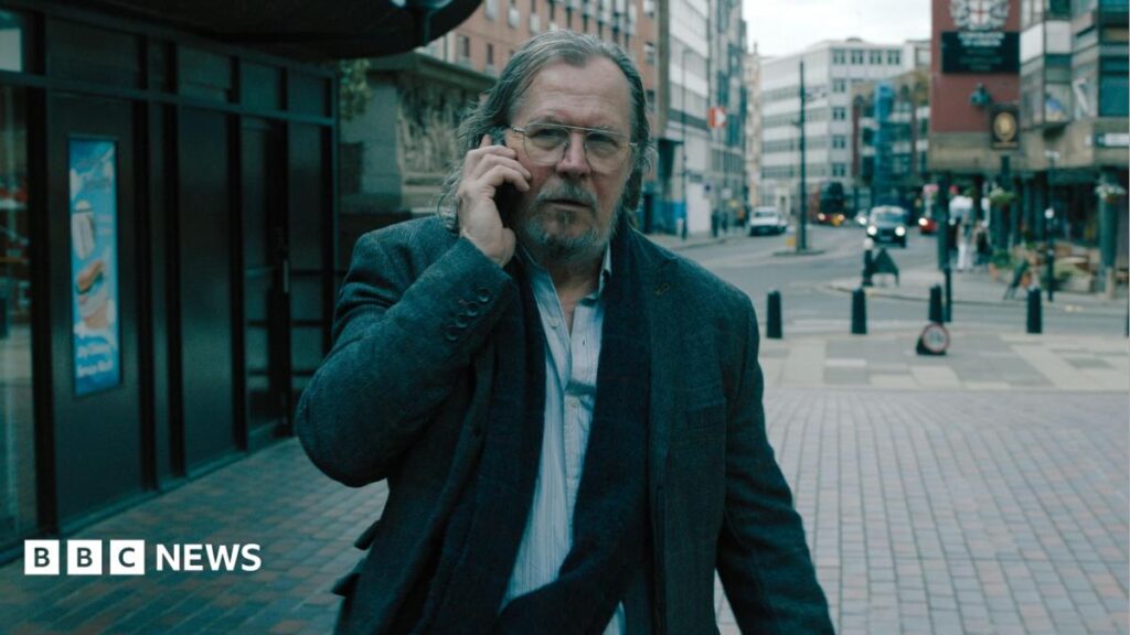 MI5 chief Sir Ken McCallum declares himself a ‘Slow Horses man’ A young girl with brown hair sat in a chair. She's facing a reporter who is holding a mic to her face.
