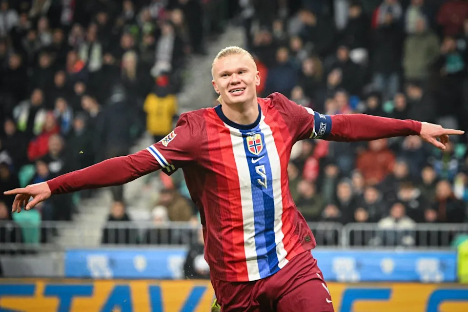 TOPSHOT – <a class="link " href="https://sports.yahoo.com/soccer/teams/norway/" data-i13n="sec:content-canvas;subsec:anchor_text;elm:context_link" data-ylk="slk:Norway;sec:content-canvas;subsec:anchor_text;elm:context_link;itc:0" data-yga="{"yLinkElement":"context_link","yModuleName":"content-canvas","yLinkText":"Norway","ySubModuleName":"anchor_text","yHasCommerce":false}">Norway</a>’s forward #09 <a class="link " href="https://sports.yahoo.com/soccer/players/1734953/" data-i13n="sec:content-canvas;subsec:anchor_text;elm:context_link" data-ylk="slk:Erling Braut Haaland;sec:content-canvas;subsec:anchor_text;elm:context_link;itc:0" data-yga="{"yLinkElement":"context_link","yModuleName":"content-canvas","yLinkText":"Erling Braut Haaland","ySubModuleName":"anchor_text","yHasCommerce":false}">Erling Braut Haaland</a> celebrates after scoring a goal during the UEFA Nations League, League B, Group 3 football match between Slovenia and Norway, at the Stozice Stadium in Ljubljana, on November 14, 2024. (Photo by Jure Makovec / AFP) (Photo by JURE MAKOVEC/AFP via Getty Images)