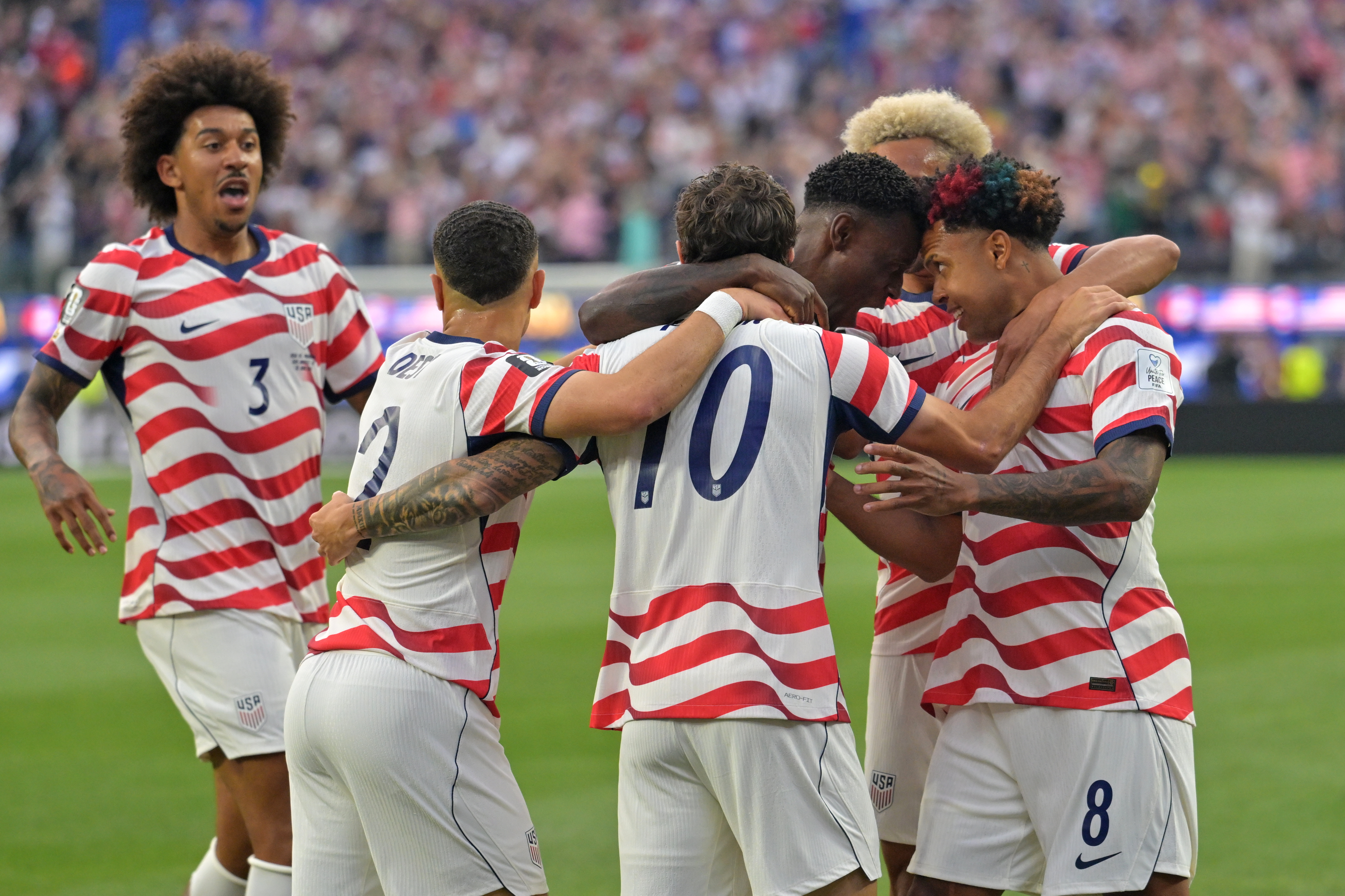 United States celebrates after an own goal by Paraguay’s Damian...