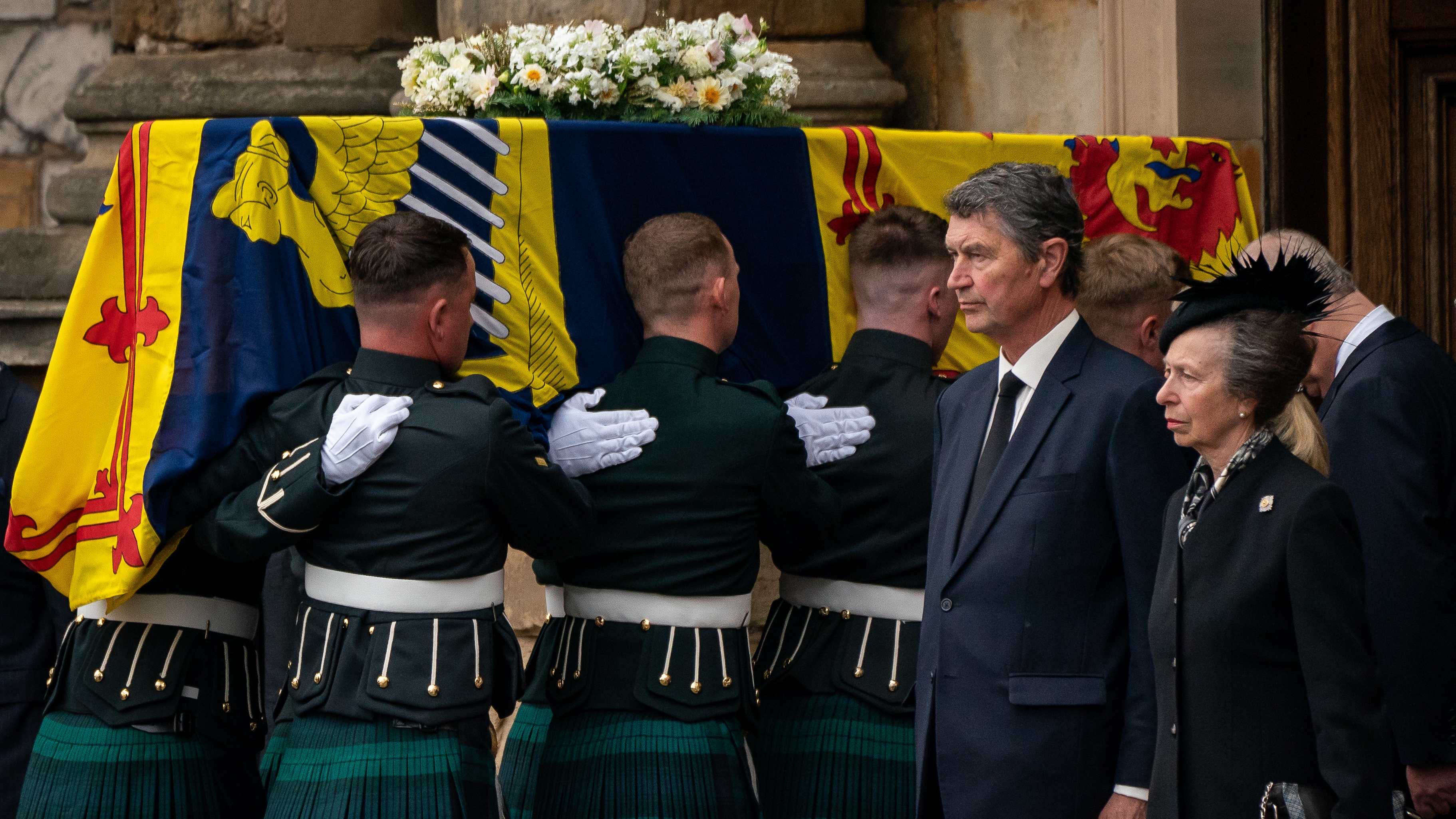 Timothy Laurence and Princess Anne stand as the coffin of Queen Elizabeth II, draped with the Royal Standard of Scotland, completes its journey from Balmoral to the Palace of Holyroodhouse