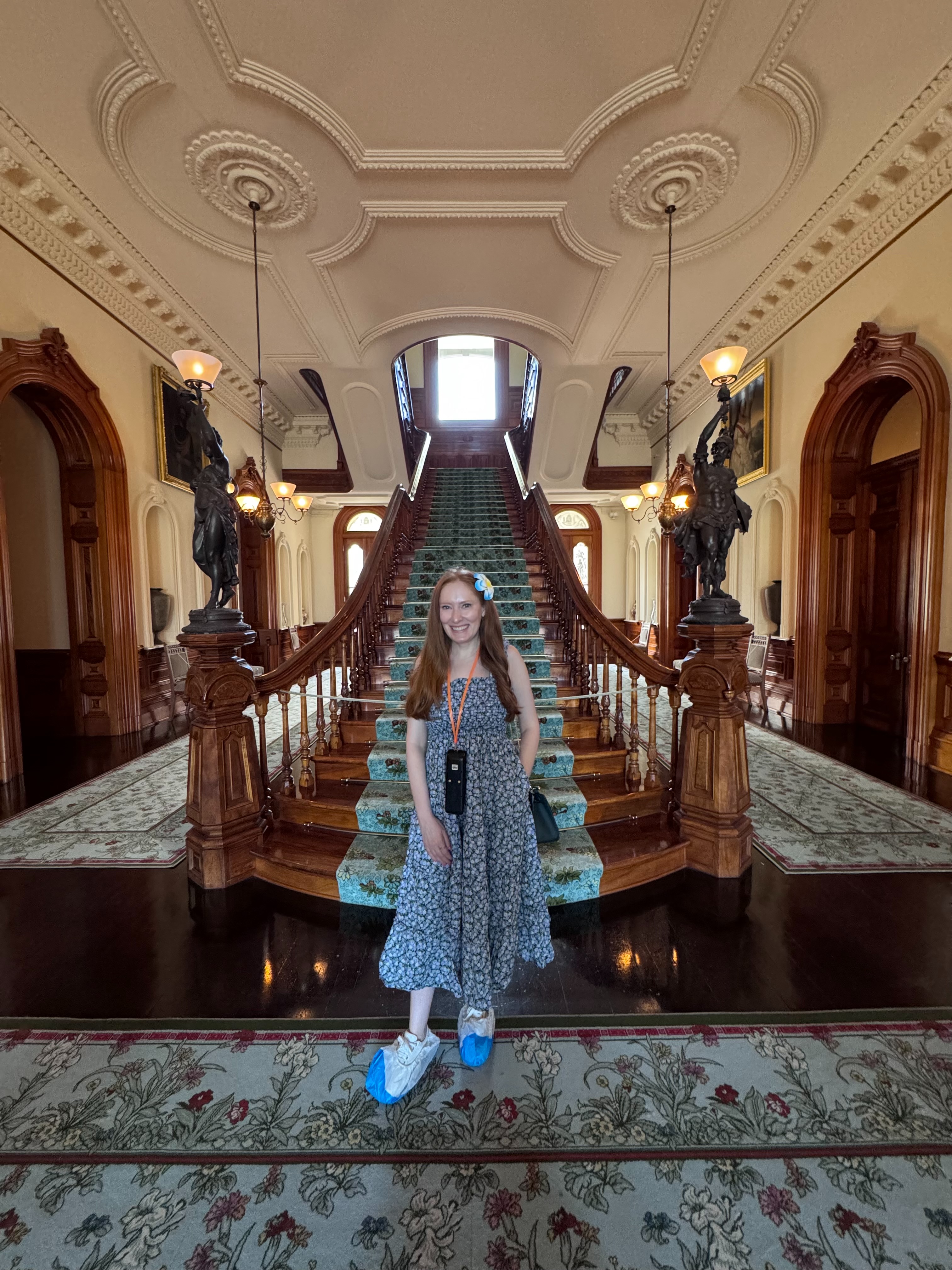 Kristin Contino standing in front of a staircase at Iolani Palace