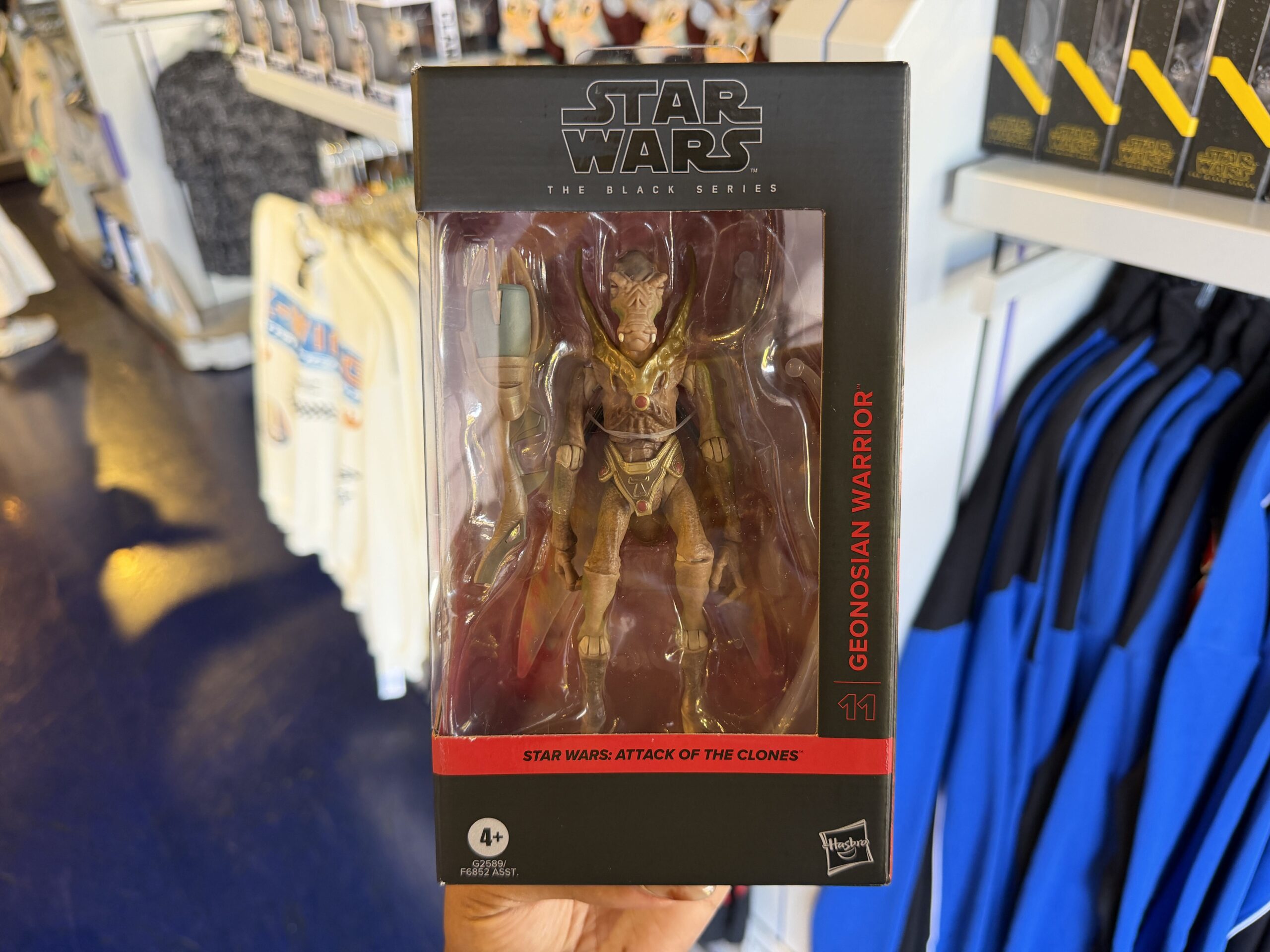 A new wave of Star Wars merchandise has arrived at Disneyland, including several graphic T-shirts, a keychain, and multiple Hasbro Black Series figures inspired by Star Wars: Attack of the Clones, The Mandalorian & Grogu, Star Tours, and more.