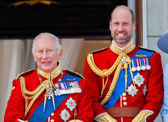 King Charles III and Prince William, Prince of Wales watch an RAF flypast from the balcony of Buckingham Palace during Trooping The Colour on June 13, 2026 in London, England.