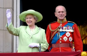 LONDON, UNITED KINGDOM - JUNE 15: The Official Birthday Of The Queen Is Marked Each Year By A Colourful Military Parade And March-past Known As Trooping The Colour With Troops From The Household Division. Queen Elizabeth Ll Smiling And Waving From The Balcony Of Buckingham Palace With Her Husband, Prince Philip (duke Of Edinburgh), Who Is Wearing The Uniform Of Colonel Of The Grenadier Guards. (Photo by Tim Graham Photo Library via Getty Images)