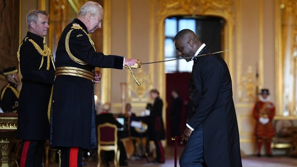 King Charles Knights Idris Elba at Windsor Castle for Services to Young People and Charity Work King Charles Knights Idris Elba at Windsor Castle for Services to Young People and Charity Work