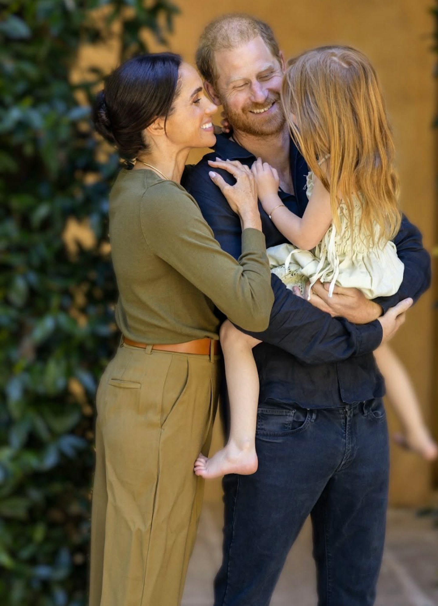 Harry and Meghan with their daughter