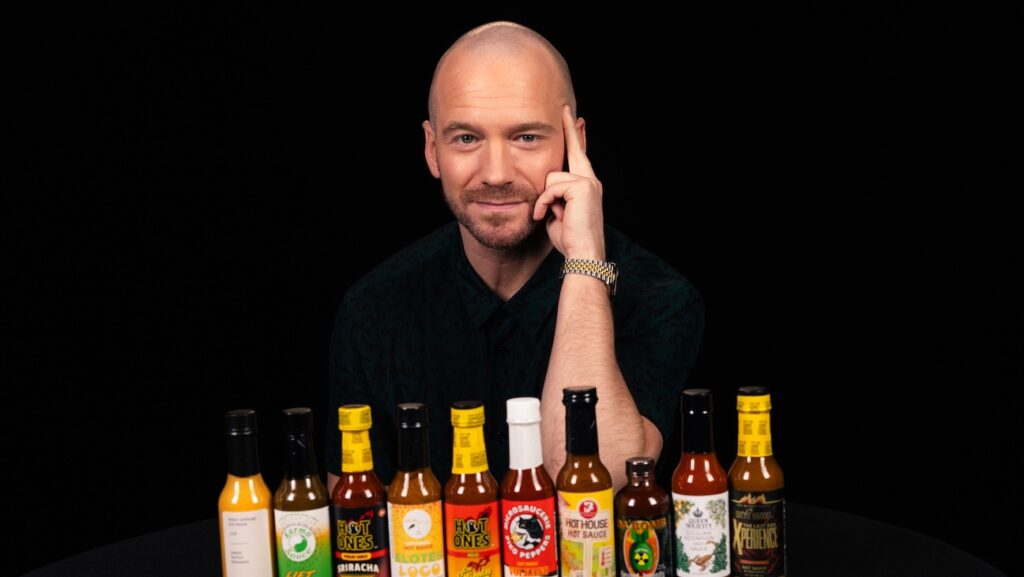 ‘Hot Ones’ Expands to Netflix with ‘Extra Heat’ Spinoff Hot Ones host Sean Evans