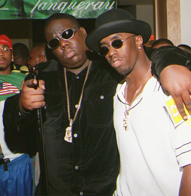 WALLACE COMBS...FILE--Notorious B.I.G., whose real name was Christopher Wallace, left, gestures as he and producer Sean 