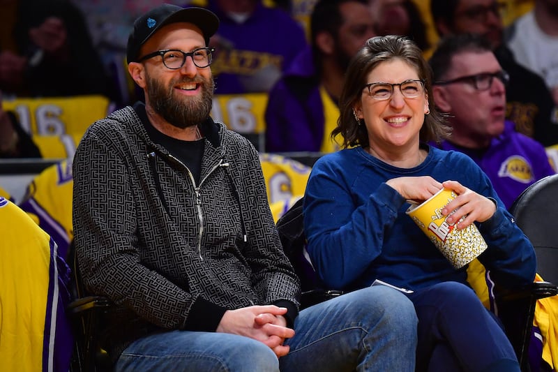 Mayim Bialik and her boyfriend, Jonathan Cohen, co-host the popular podcast "Mayim Bialik's Breakdown." Pictured here together in 2023.