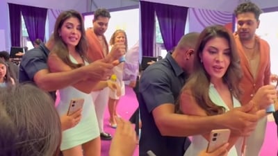 Jacqueline Fernandez bodyguard holds her wrist, stops her from clicking pictures with fans.