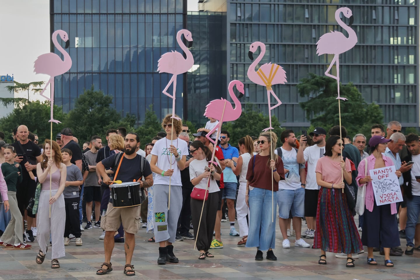 Protesters held pink flamingo cutouts during a demonstration Wednesday in Tirana.